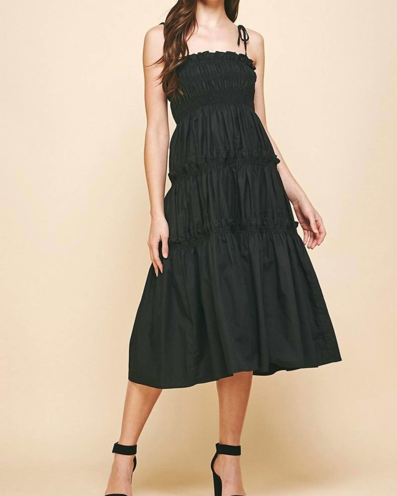 Front of a model wearing a size Large Everleigh Midi Dress in Black in Black by PINCH. | dia_product_style_image_id:338236
